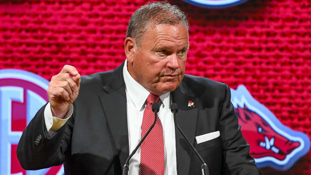 Razorbacks coach Sam Pittman at the podium on the main stage at SEC Media Days